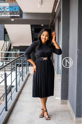 Elegant black pleated midi dress