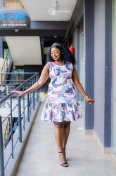 Elegant sleeveless abstract print A-line dress with ruffled hem