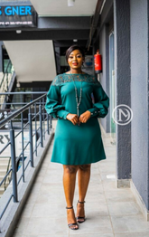 Elegant emerald green lace yoke A-line shift
