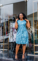 Chic sleeveless Maya blue sheath with floral motif