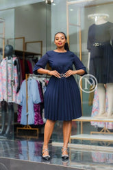 Elegant navy blue pleated skater dress