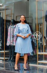 Elegant light blue pleated skater dress