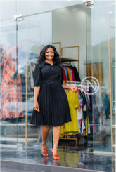 Chic black pleated skater dress
