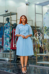Elegant light blue skater dress with pleats