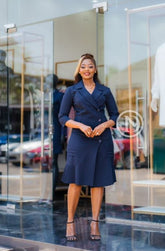 Elegant navy blue blazer dress with a pleated hem