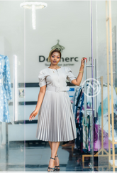 Elegant office dress with pleats