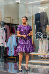 Elegant purple shift dress with ruffled hem