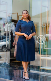 Elegant navy blue official pleated peplum dress