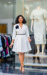 Elegant white polka dot skater dress