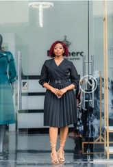 Elegant black dress with pleats.