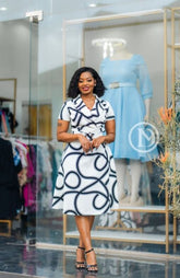 Elegant white with black skater dress.