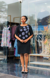 Elegant black shift dress with circular prints