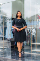 Elegant black pleated skater dress