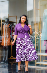 Purple and white pleated peplum midi dress