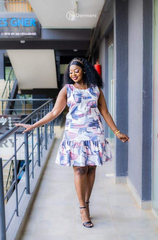 Elegant sleeveless abstract print A-line dress with ruffled hem