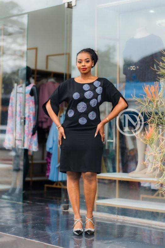 Elegant black shift dress with circular prints