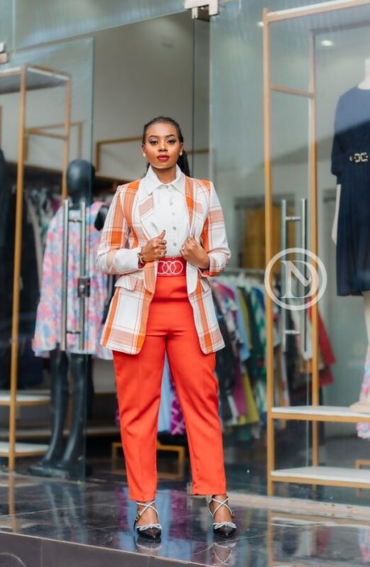 Two-piece white blouse and orange trouser