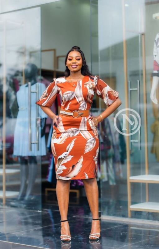 Elegant burnt orange abstract print sheath dress