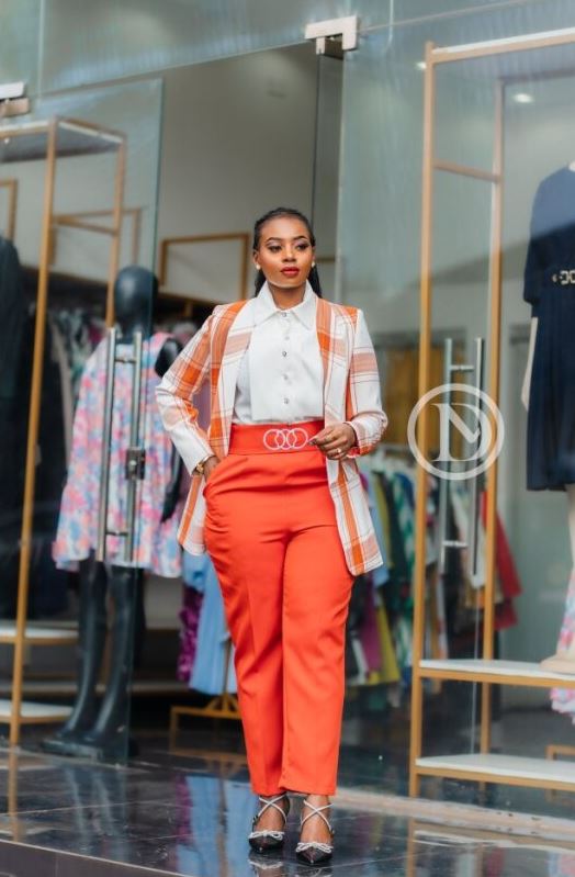 Two-piece white blouse and orange trouser
