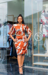 Elegant burnt orange abstract print sheath dress