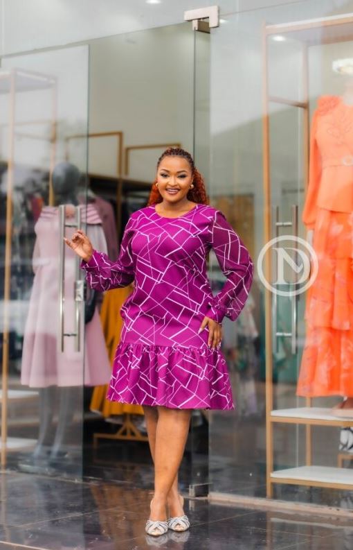 Elegant purple shift dress with ruffled hem