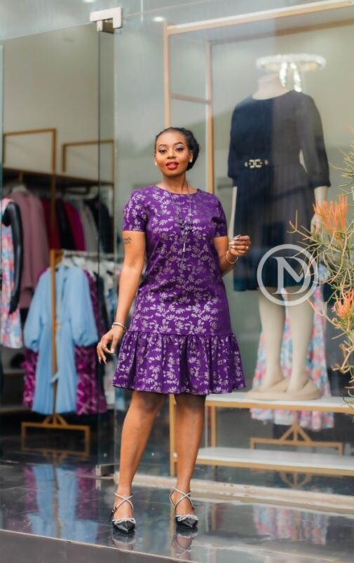 Elegant purple shift dress with ruffled hem