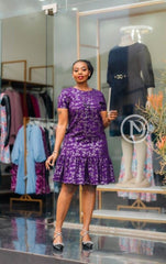 Elegant purple shift dress with ruffled hem
