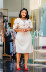 Elegant cream-beige midi dress with bow