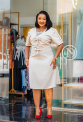 Elegant cream-beige midi dress with bow